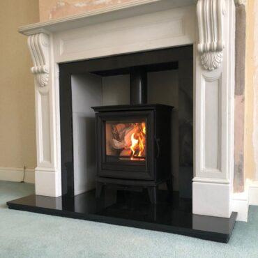 Stovax Chesterfield 5 Multi-fuel Stove with Polished granite hearth and surround.