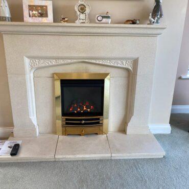 Installation of a Gazco Logic HE Inset Gas Fire with Moulded Coals featuring the Brass Fret & Frame
