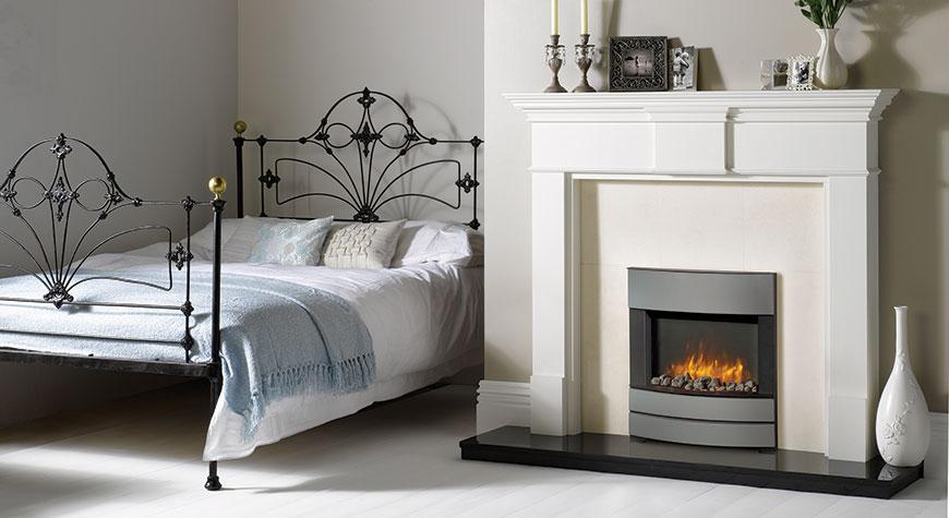 Cosy bedroom featuring the Gazco Logic2 electric fire with Progress front