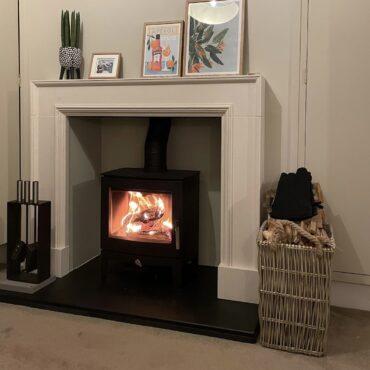 Stovax Futura 5 installation with limestone fireplace and slate hearth